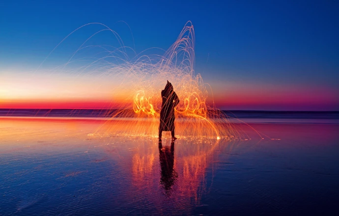 person with light effect surrounded with water